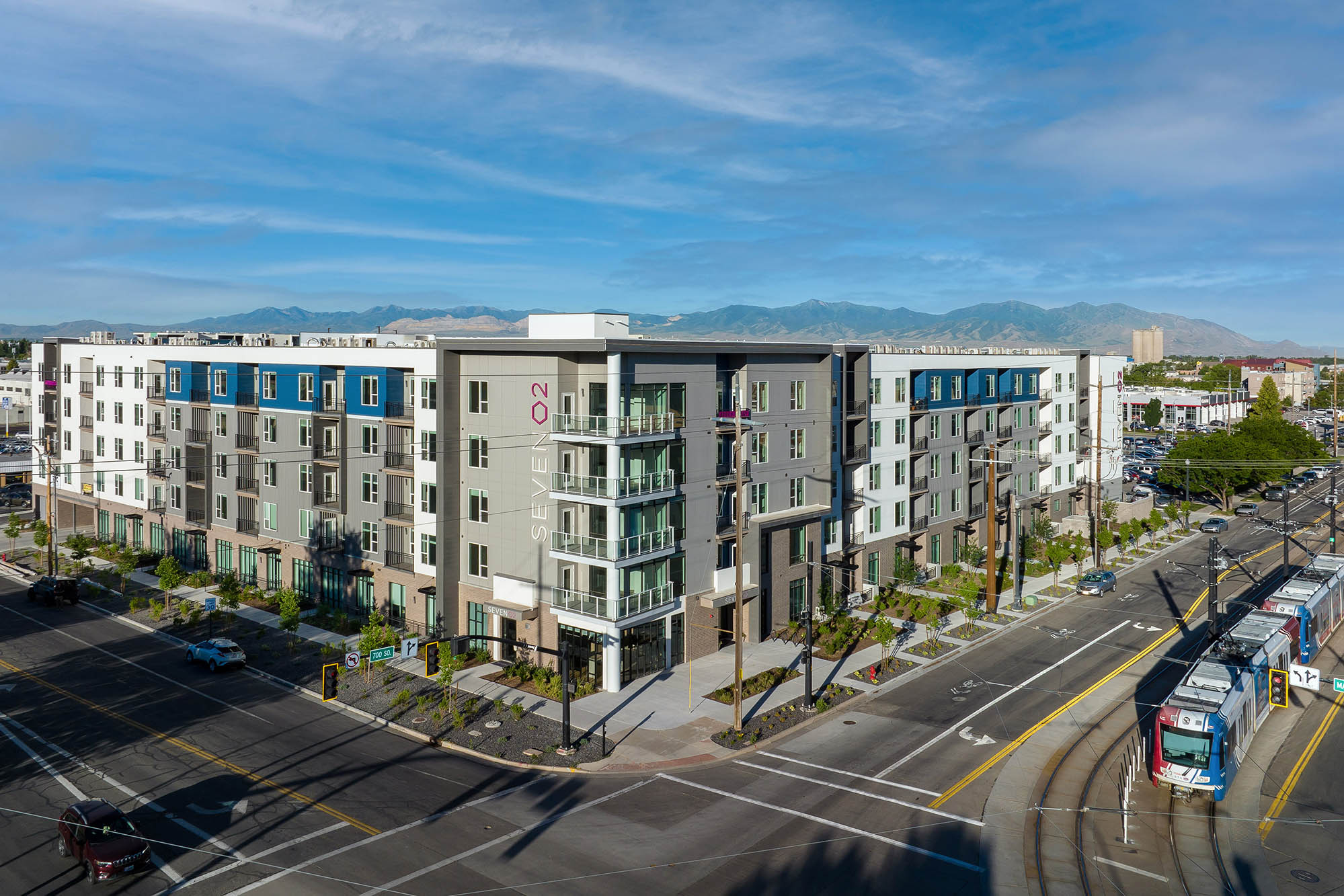 Seven-02-Apartments-Exterior-North-East-Corner-Trax-Train-Morning-Cropped