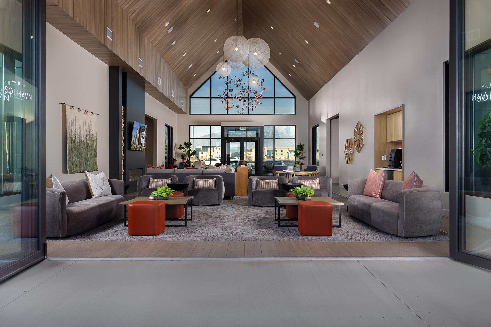 Solhavn-Apartments-Interior-Clubhouse-Lounge-Seating-Through-Open-Doors-Single-Point