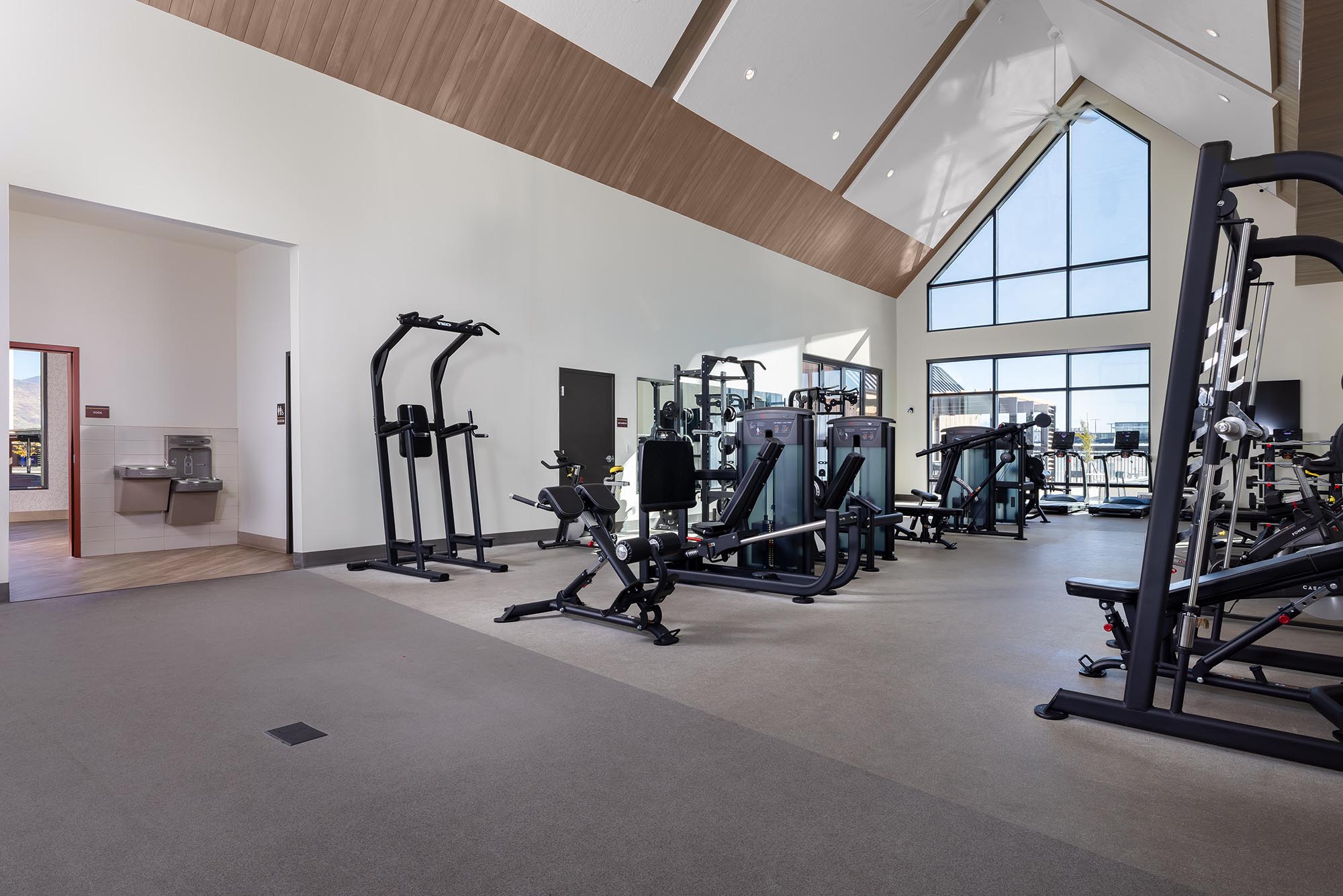 Solhavn-Apartments-Interior-Clubhouse-Weight-Room-and-Hallway-Angle